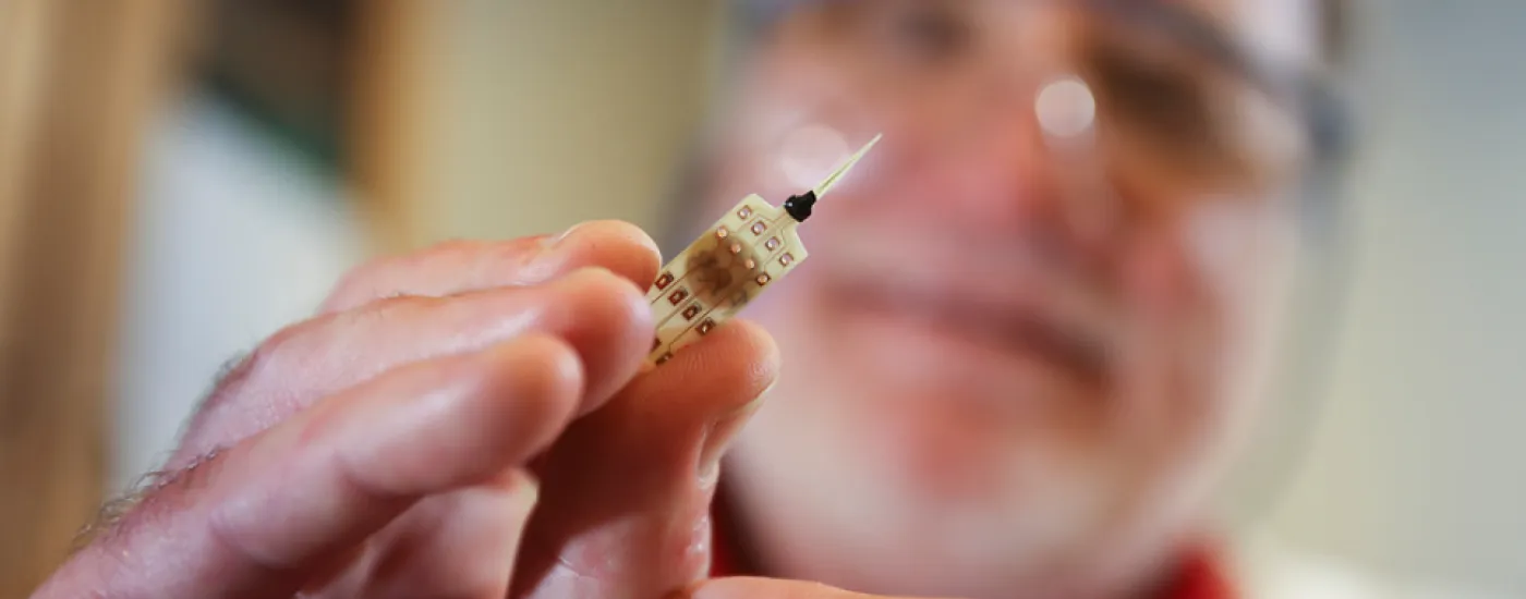 researcher with a microelectrode