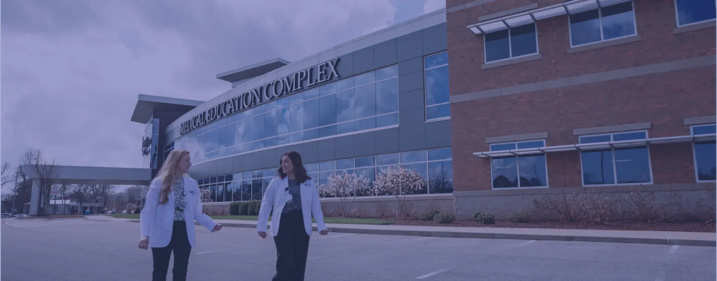 two medical students walking outside of the bowling green facility