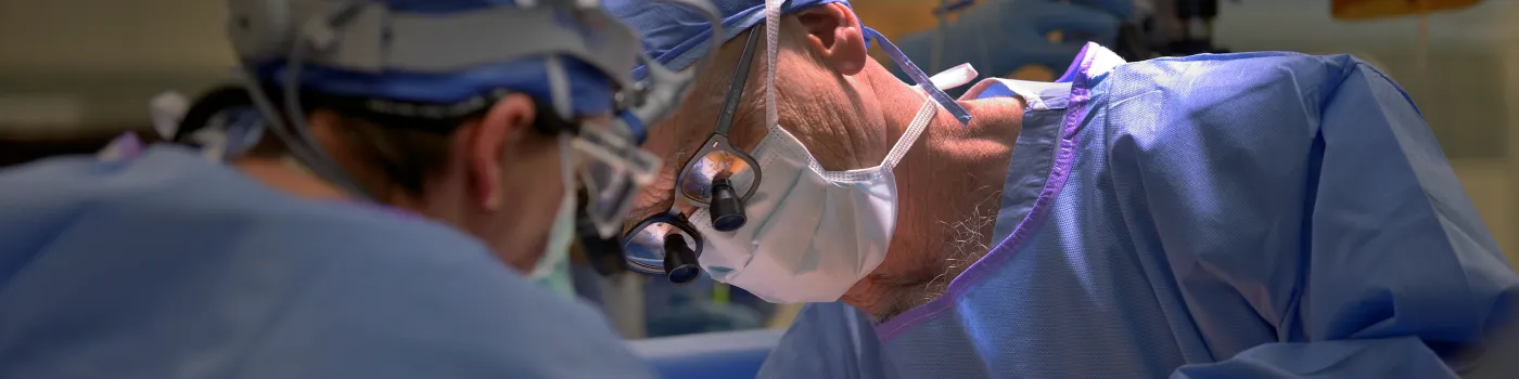 Surgery operating room. Close-up on surgeon.