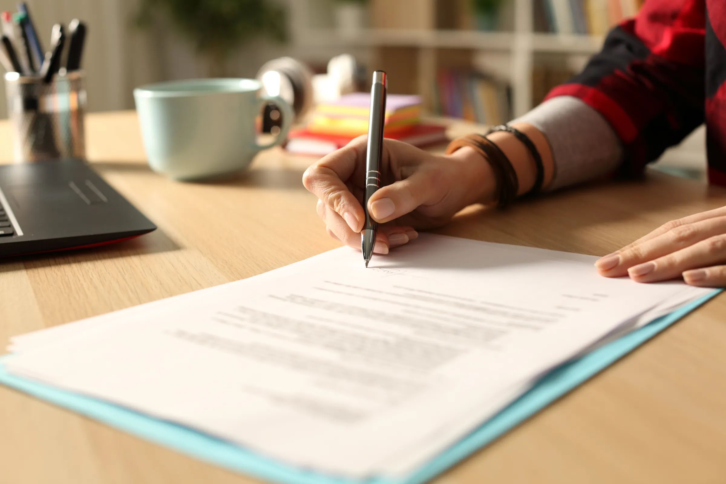 Person writing a grant